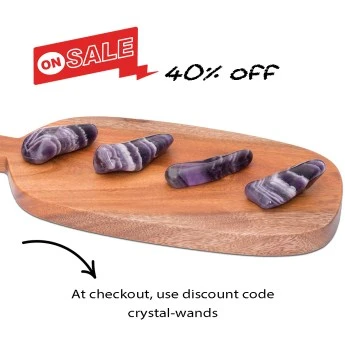 four chevron amethyst crystal wands on a wooden board